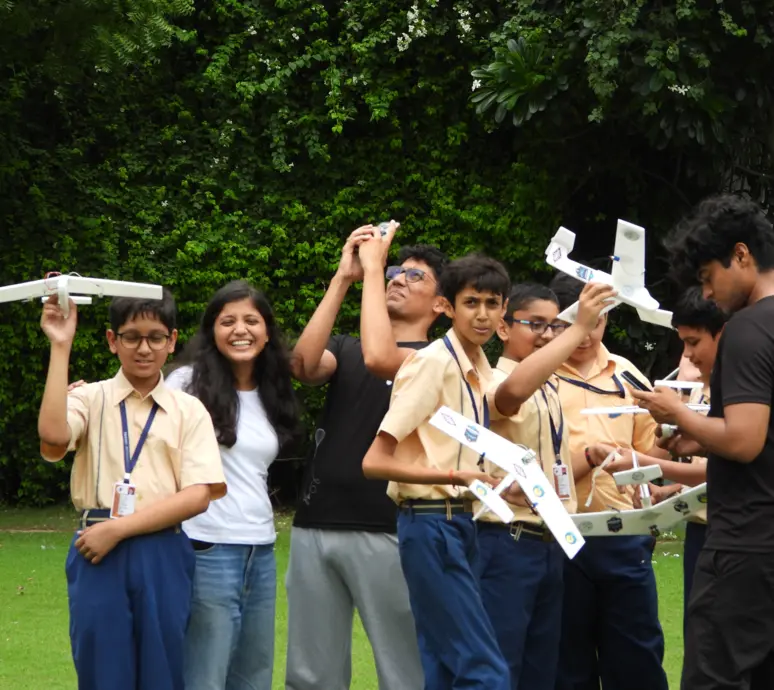 Students learning aerospace engineering at AeroUdaan aviation workshop - hands-on aircraft building session