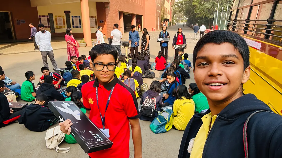 Students celebrating successful drone flight at Exxler workshop